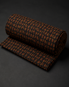 Black Fabric with Miniature Rust and Ochre Motifs